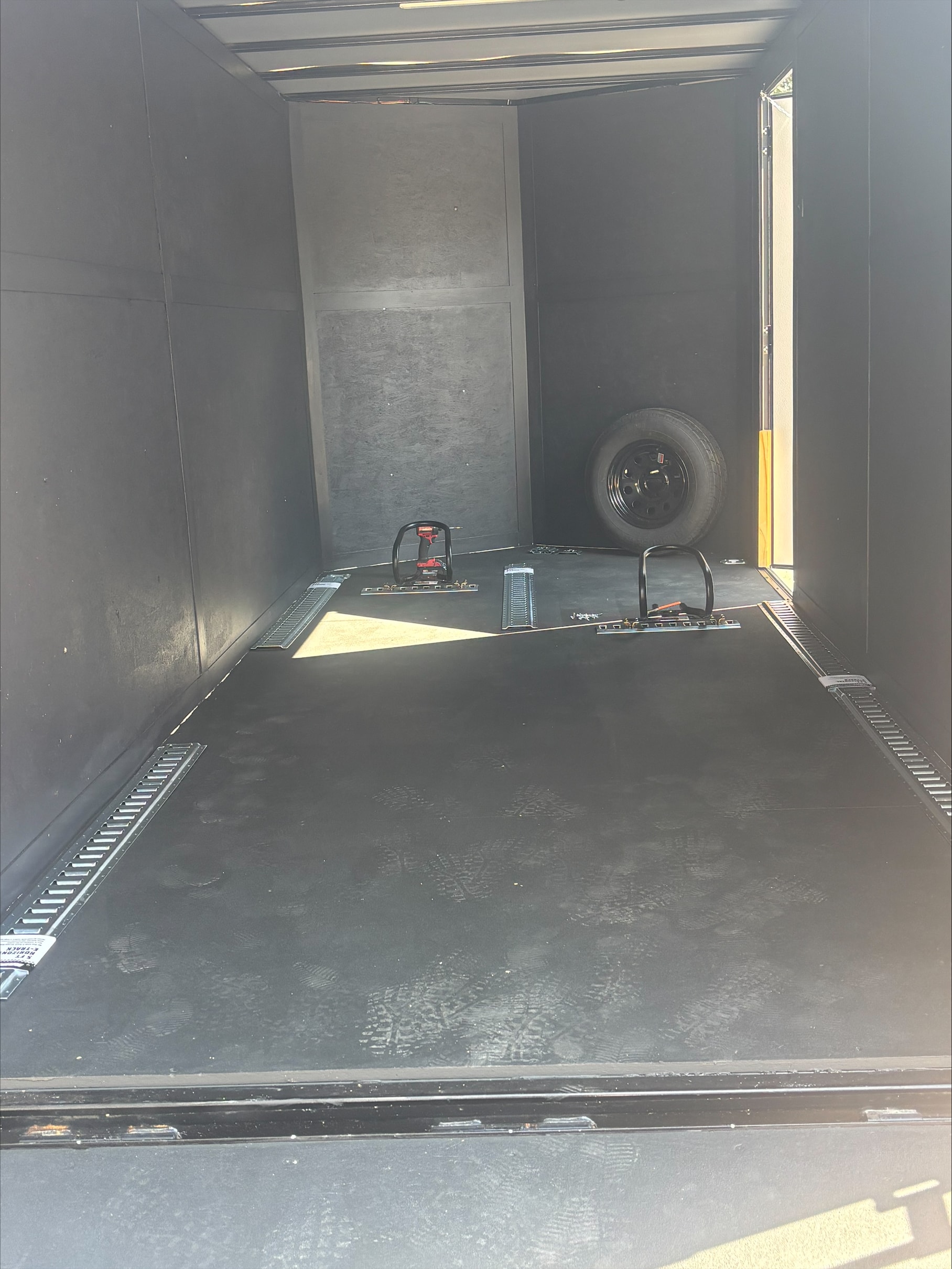 7x16 enclosed trailer interior with full E-Track and spring-assist ramp — Universal City TX